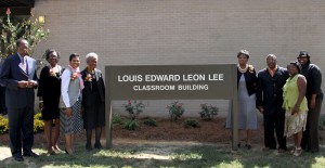 Family members of Louis Lee along with Hinds Community College Board of Trustees President Robert Pickett, far left, unveil the sign for the Louis Edward Leon Lee Classroom Building on the Utica Campus.