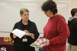 Jane Skinner, director of the nursing program at Hinds Community College's Vicksburg-Warren Campus, talks with Wanda Vines of Vicksburg at the Jan. 24 nursing showcase.
