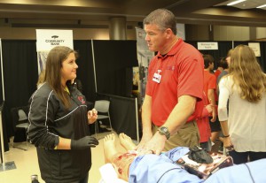 Brian Staley, an instructor in Hinds’ Emergency Medical Sciences program at Jackson Campus-Nursing/Allied Health Center, used a mannequin with a serious leg wound to show Florence Middle School eighth-grader Taylor McBay how to use pressure to stop bleeding. “Health care is a great place to be. This is a great curriculum,” he said.